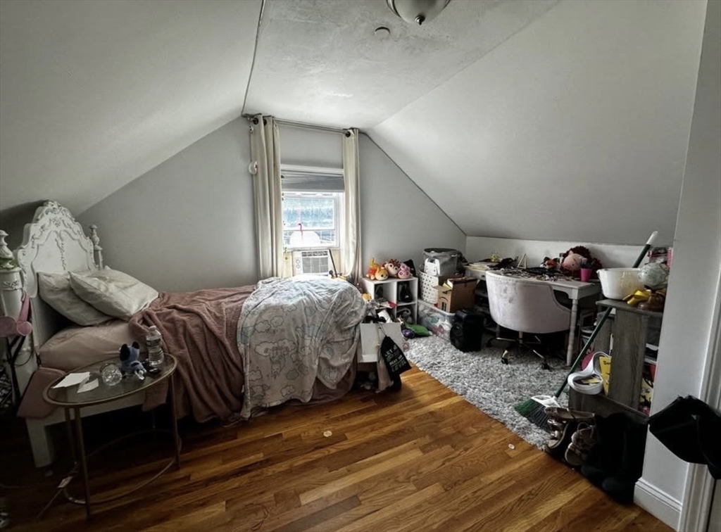 69 Beacon Street, Unit 3 Chelsea, MA 02150 - Photo 8 of 9 a bedroom with bed and a window