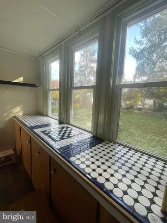 a utility room with closet and a window
