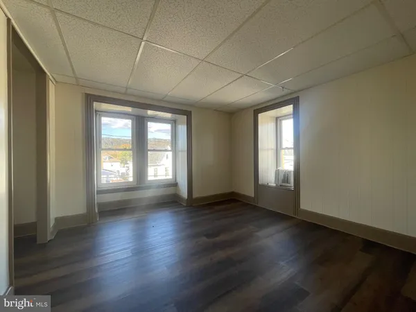 a view of a room with large windows