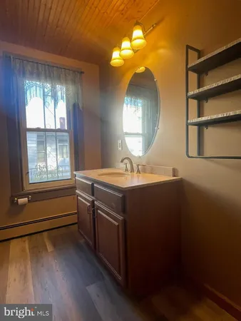 a bathroom with a shower curtain and toilet
