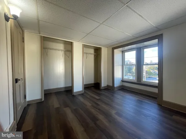 a view of wooden floor in an empty room