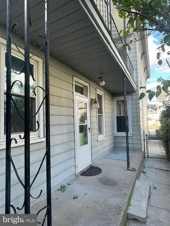 a view of a porch with wooden floor