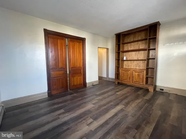 an empty room with a empty space and window