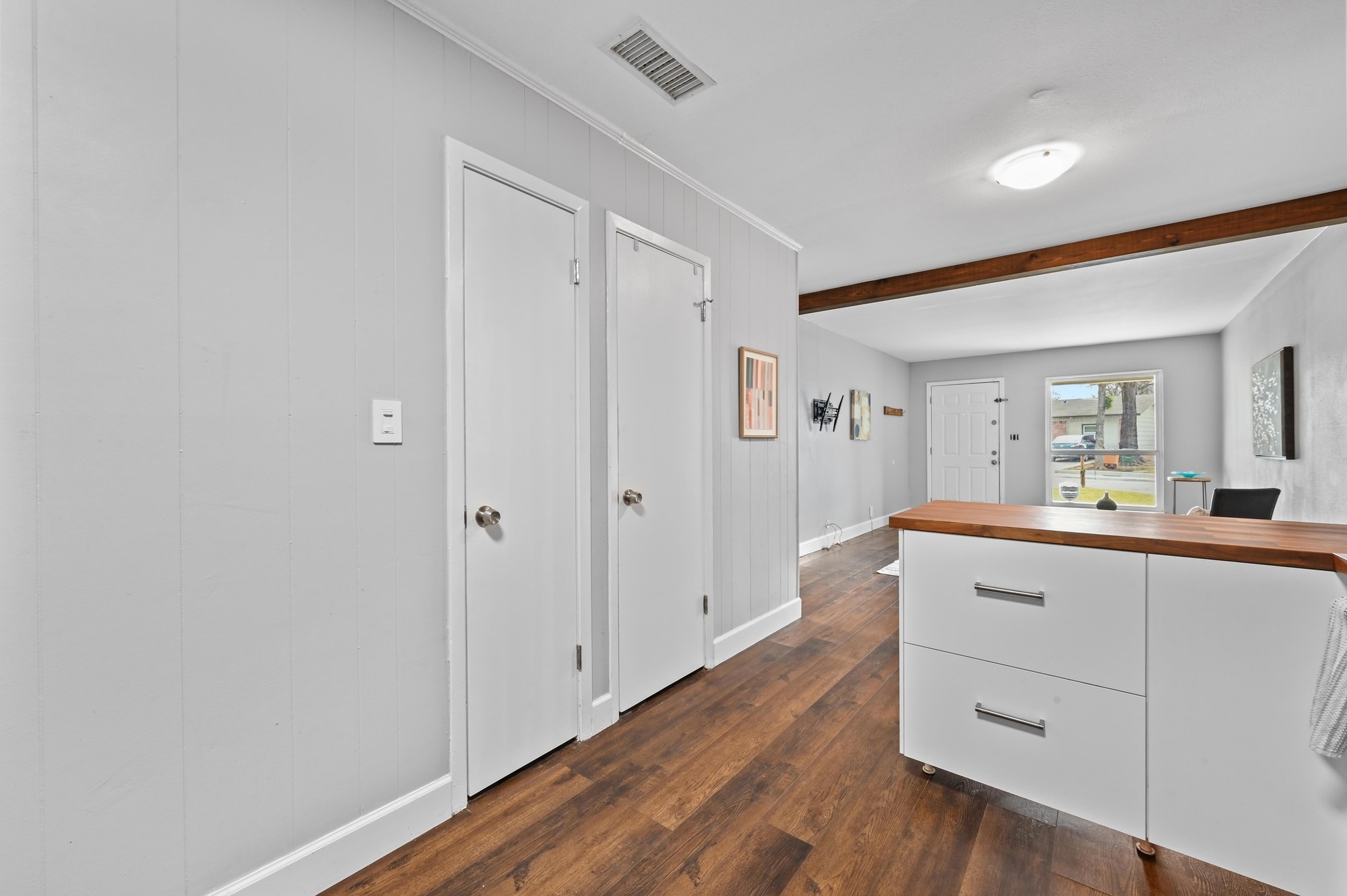 6302 Thurgood Avenue Austin, TX 78721 - Photo 12 of 31 a room with white cabinets and wooden floor