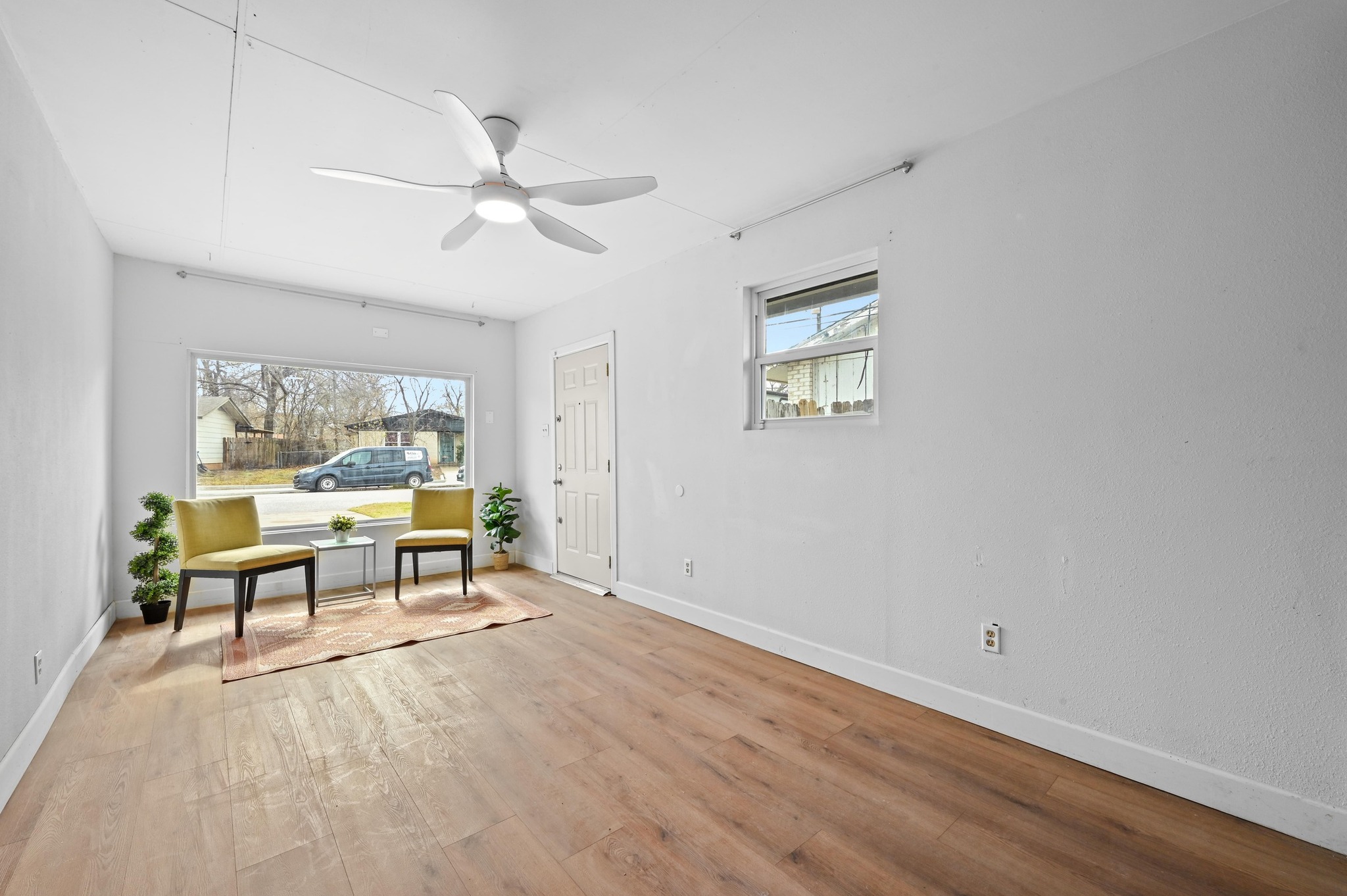 6302 Thurgood Avenue Austin, TX 78721 - Photo 13 of 31 a view of a workspace with wooden floor and a window