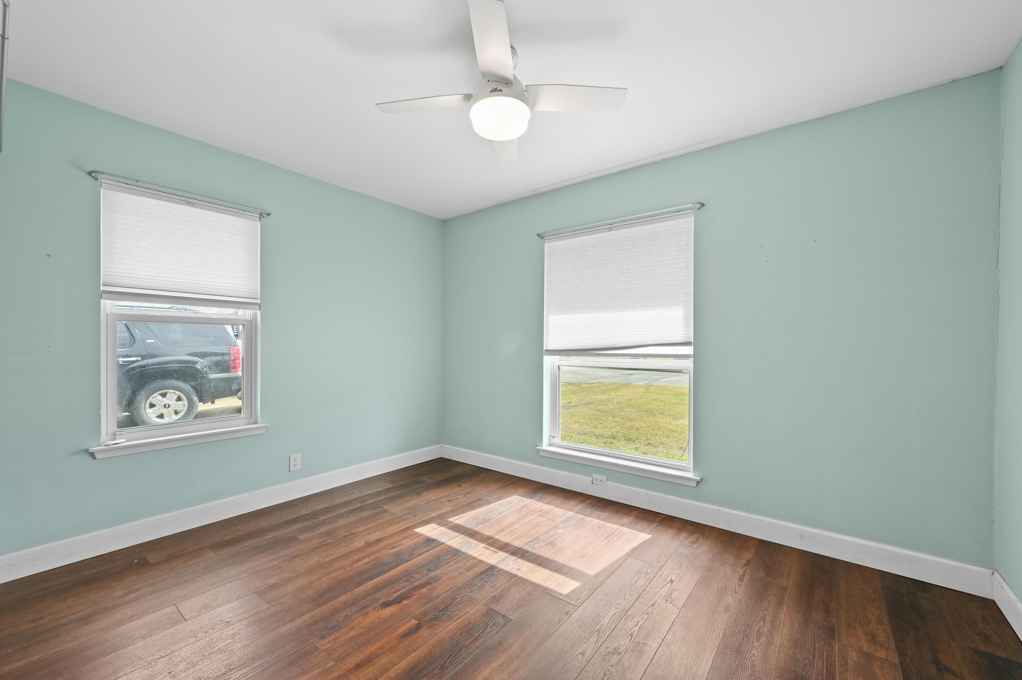 6302 Thurgood Avenue Austin, TX 78721 - Photo 14 of 31 an empty room with window and wooden floor