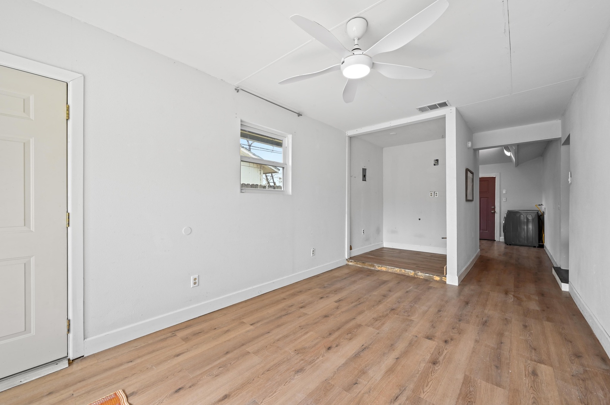 6302 Thurgood Avenue Austin, TX 78721 - Photo 19 of 31 a view of an empty room with wooden floor