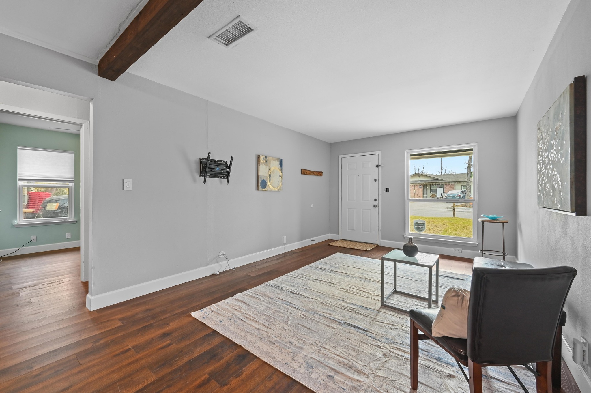 6302 Thurgood Avenue Austin, TX 78721 - Photo 7 of 31 a workspace room with wooden floor and windows