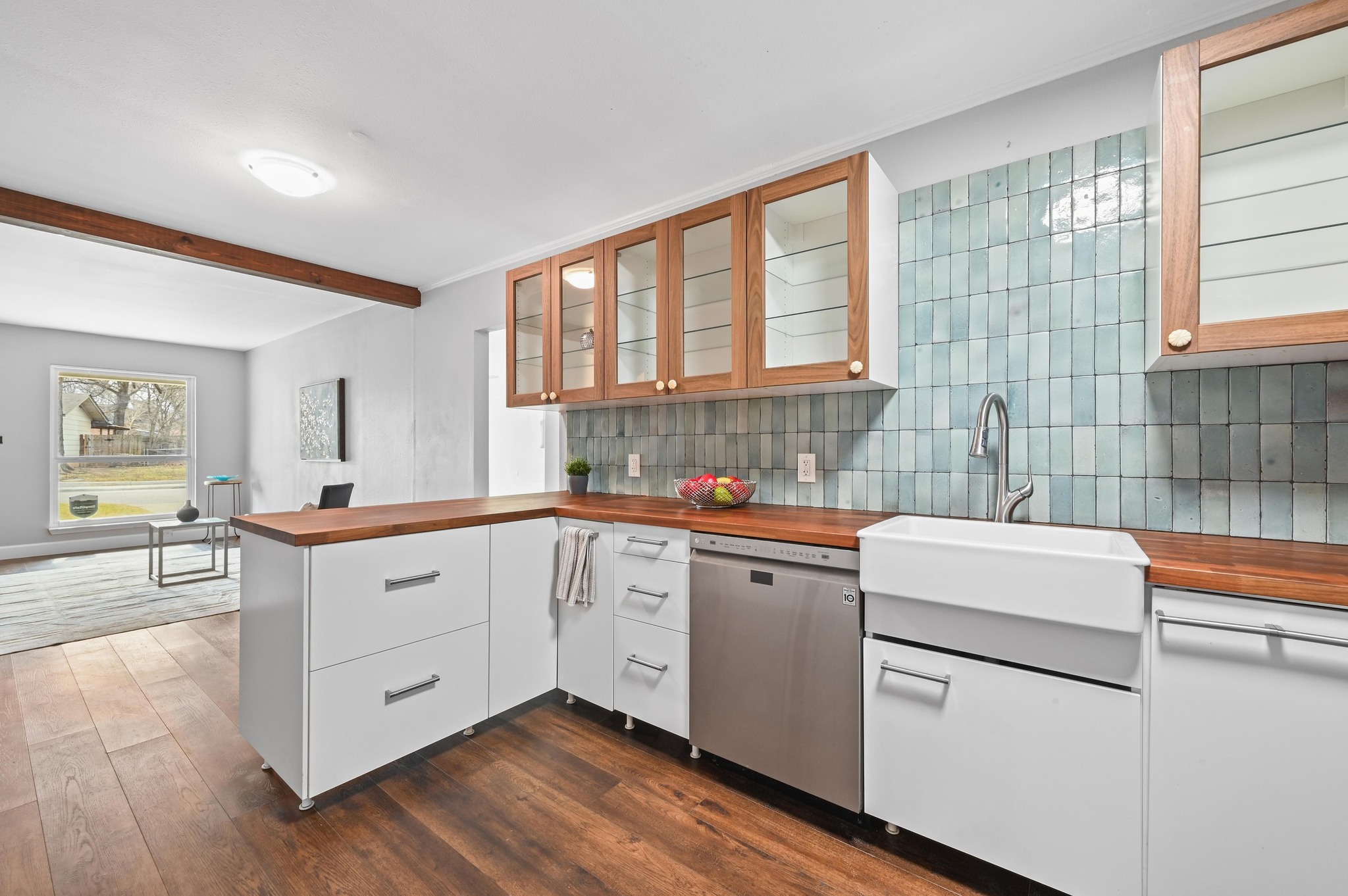 6302 Thurgood Avenue Austin, TX 78721 - Photo 10 of 31 a kitchen with sink cabinets and window