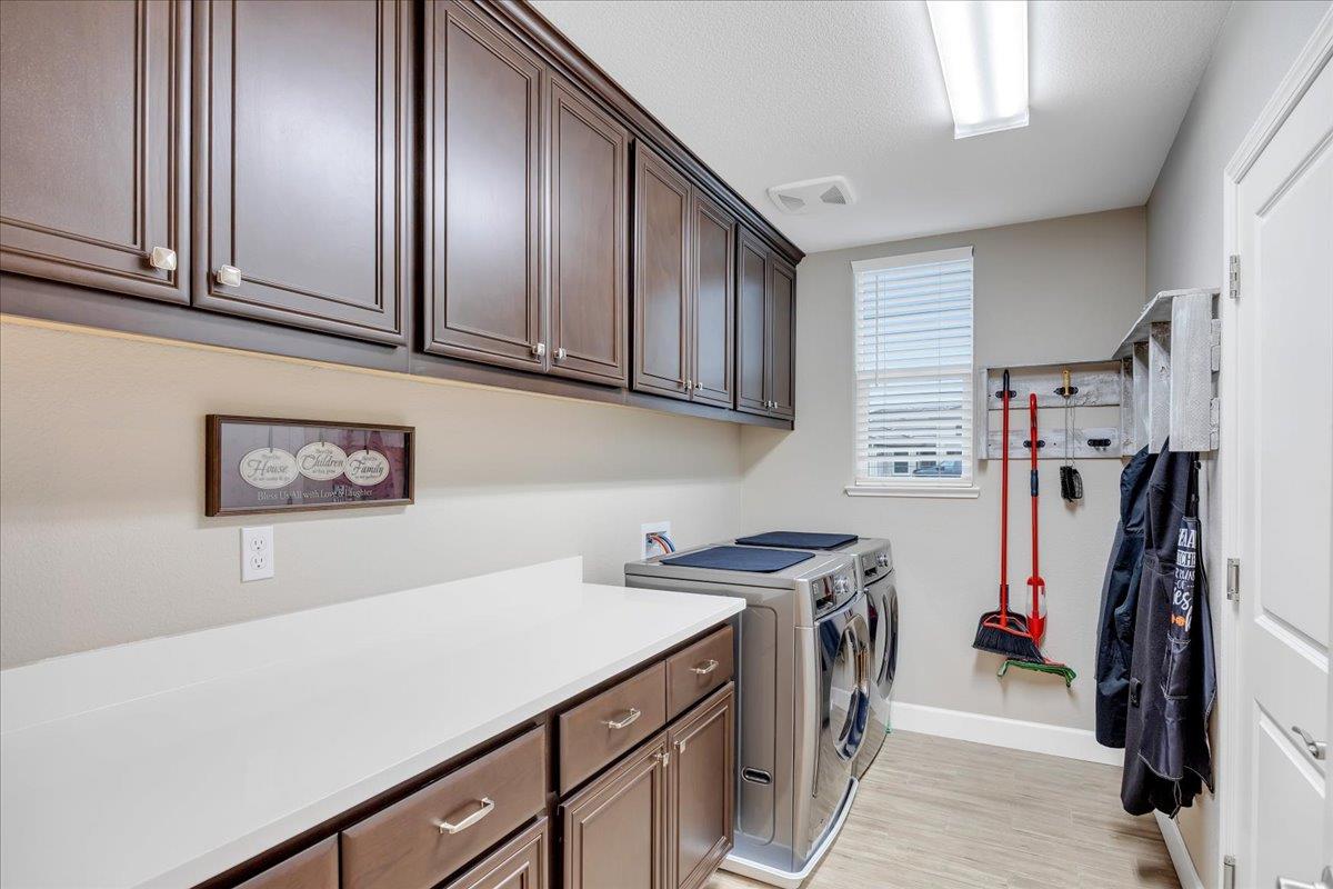 133 Palisades Place Copperopolis, CA 95228 - Photo 53 of 95 The spacious laundry room with cultured-marble countertop offers space to store & fold.