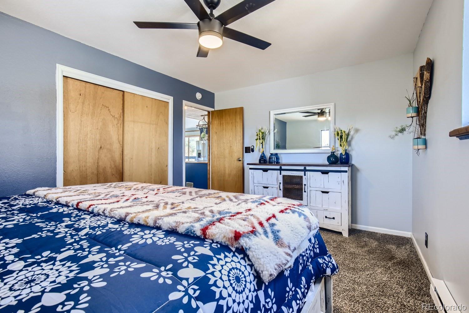 44 Bandit Lane Bailey, CO 80421 - Photo 12 of 30 a bedroom with a bed and a dresser
