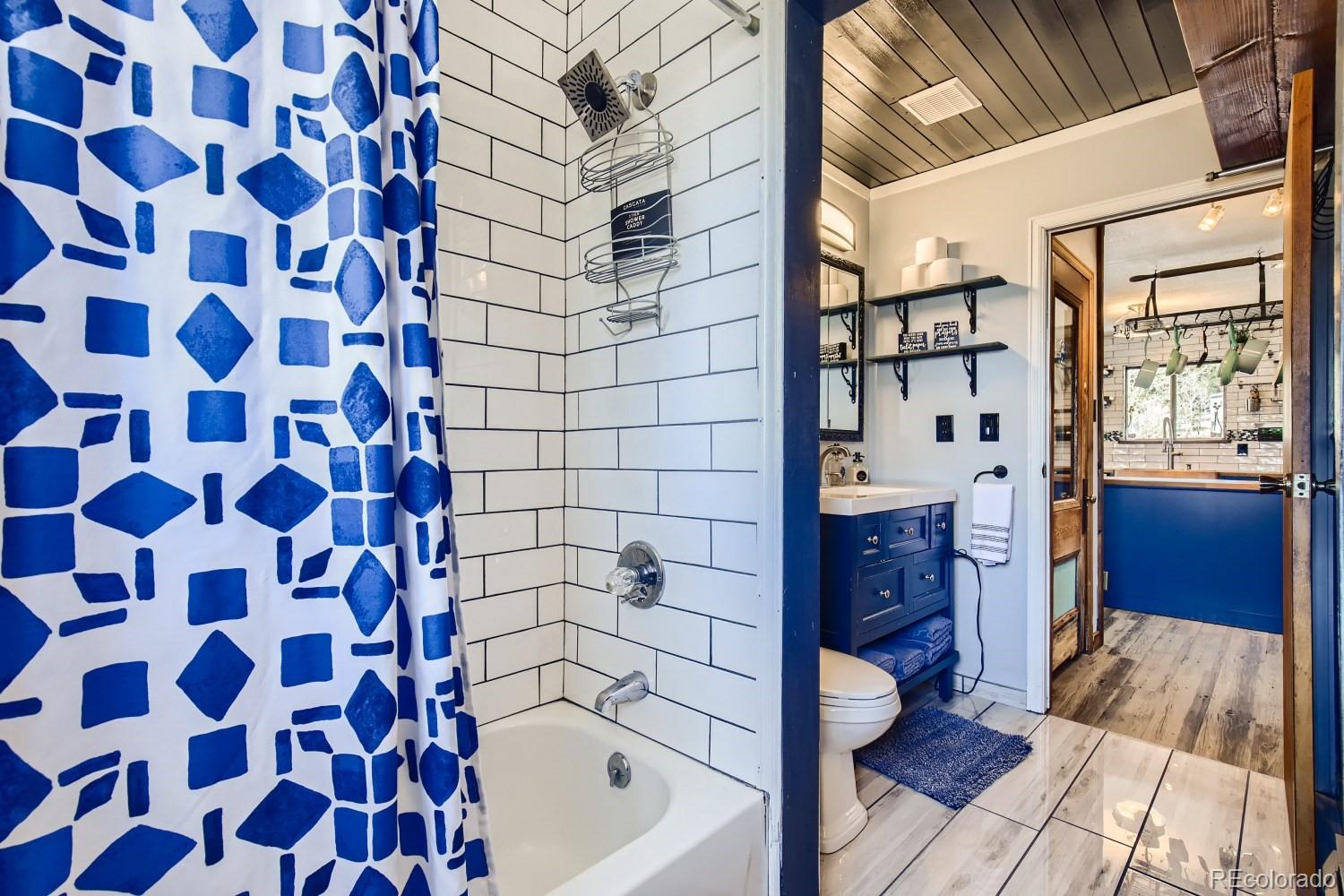 44 Bandit Lane Bailey, CO 80421 - Photo 15 of 30 a bathroom with a bathtub and a shower