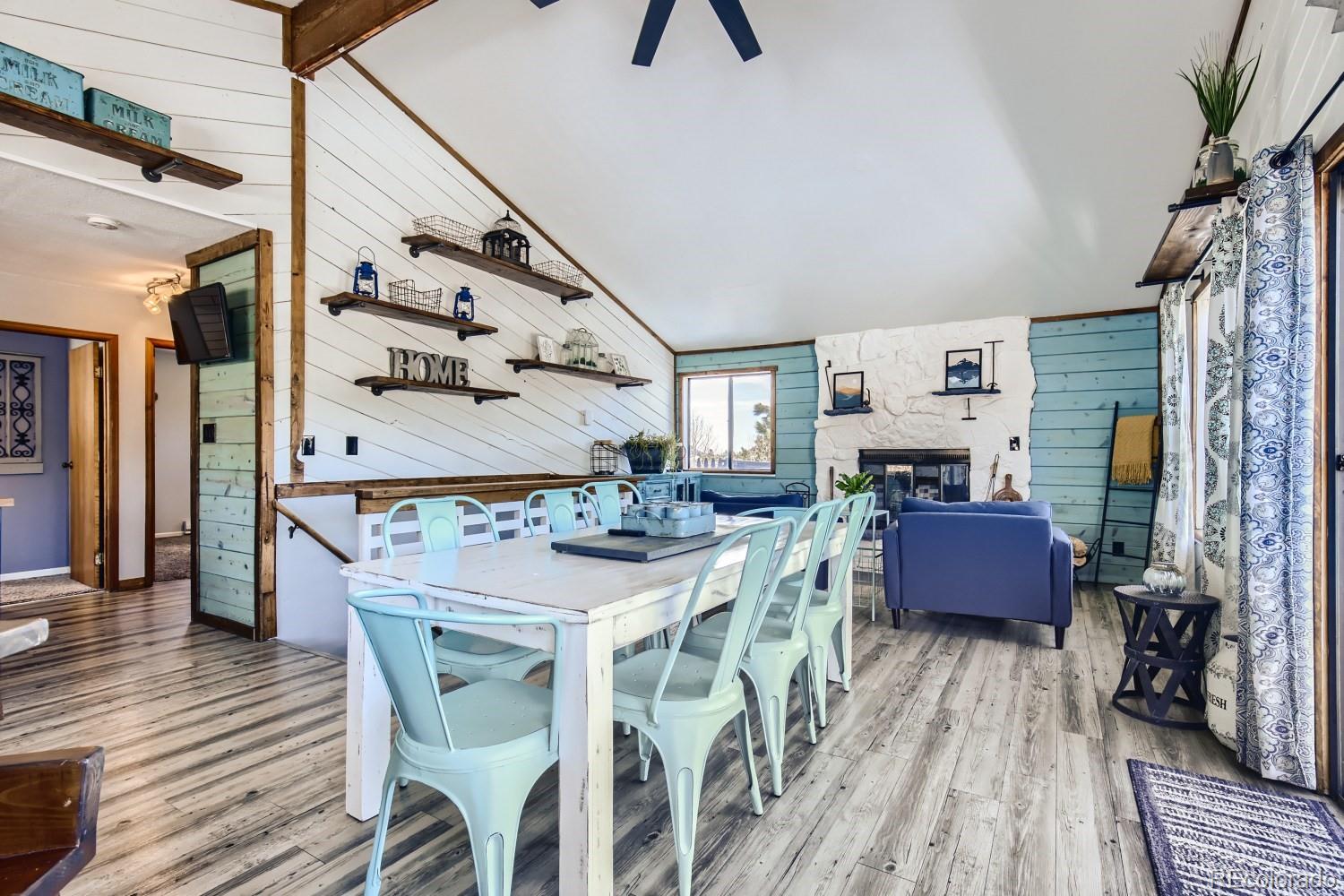 44 Bandit Lane Bailey, CO 80421 - Photo 18 of 30 a view of a dining room with furniture window and wooden floor