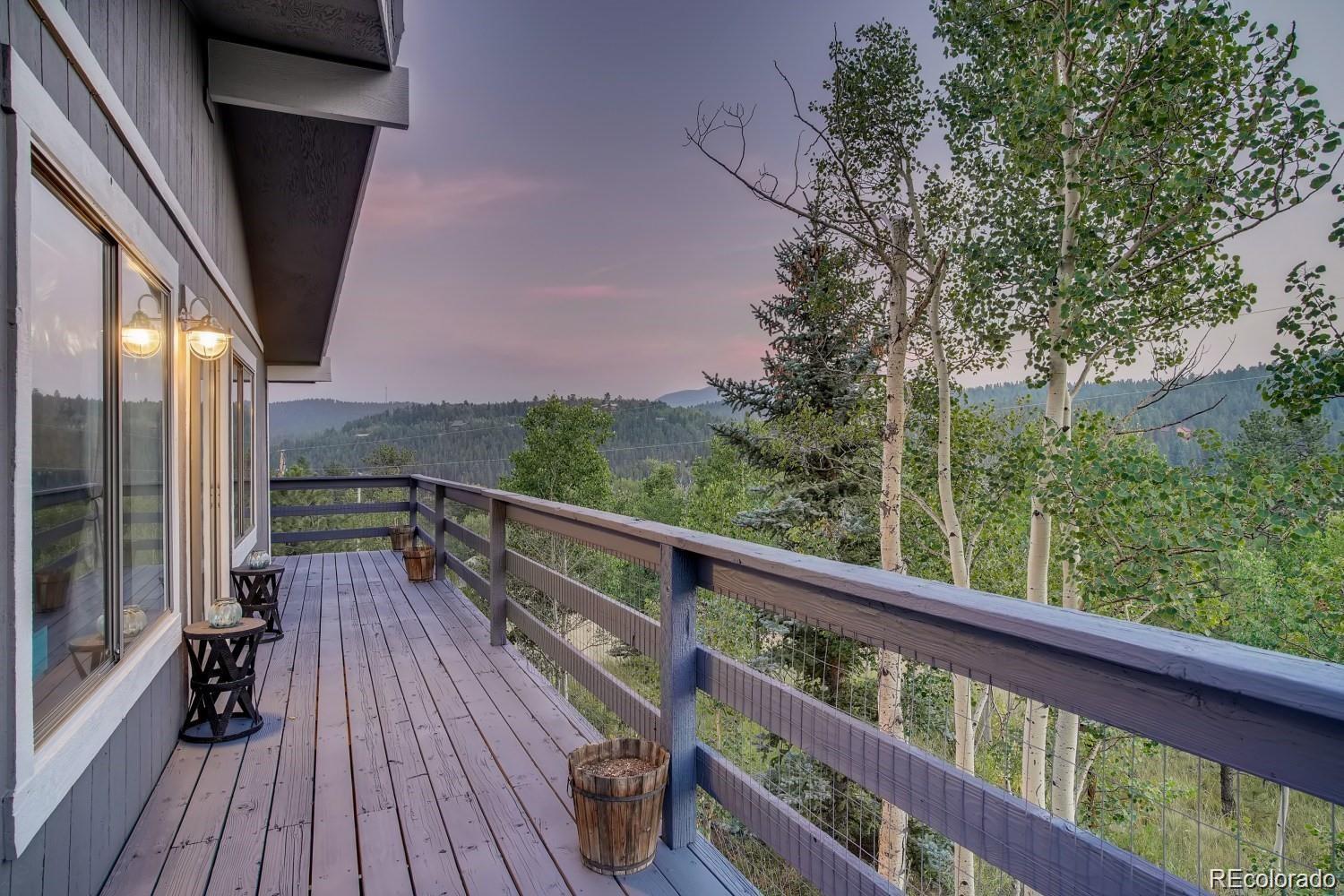 44 Bandit Lane Bailey, CO 80421 - Photo 23 of 30 a view of balcony with wooden floor and fence