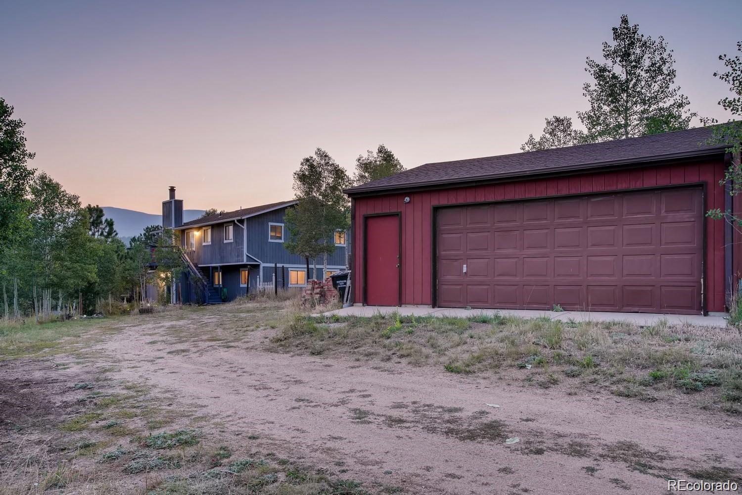 44 Bandit Lane Bailey, CO 80421 - Photo 27 of 30 a view of a house with a backyard