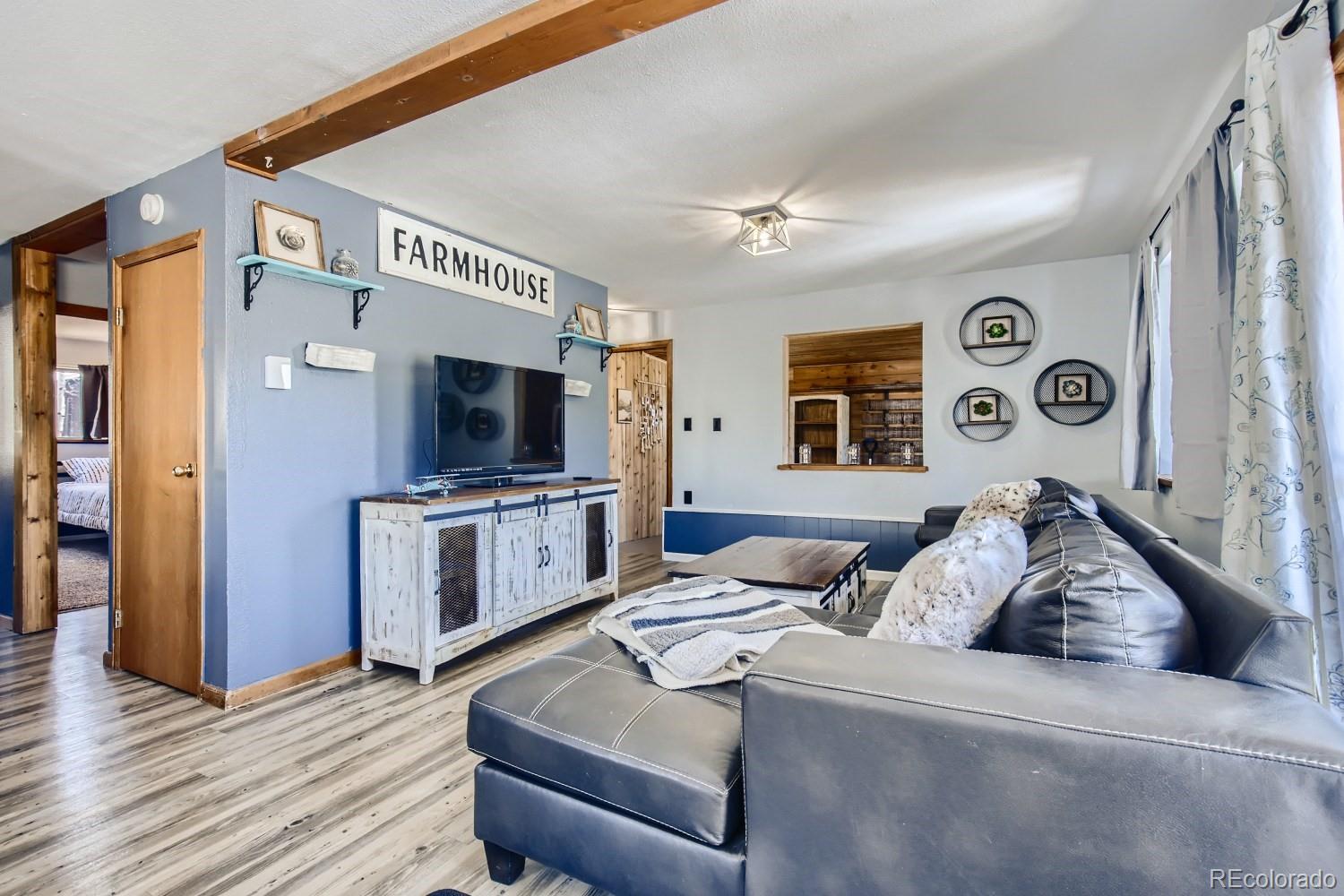 44 Bandit Lane Bailey, CO 80421 - Photo 5 of 30 a living room with furniture and a flat screen tv