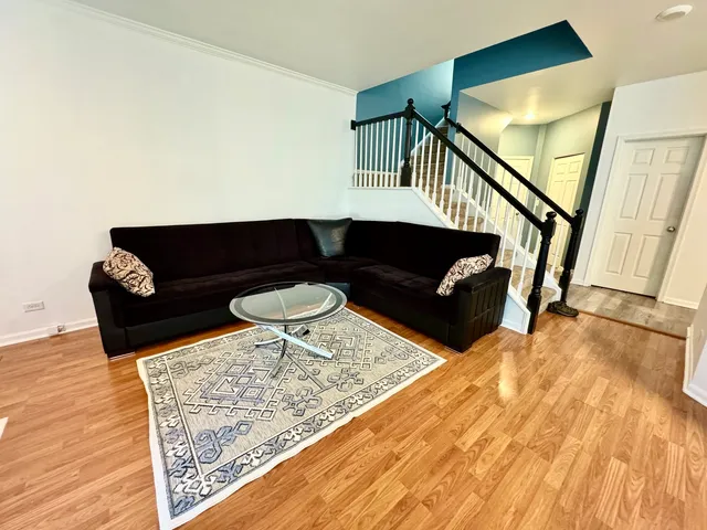 a living room with furniture and a rug