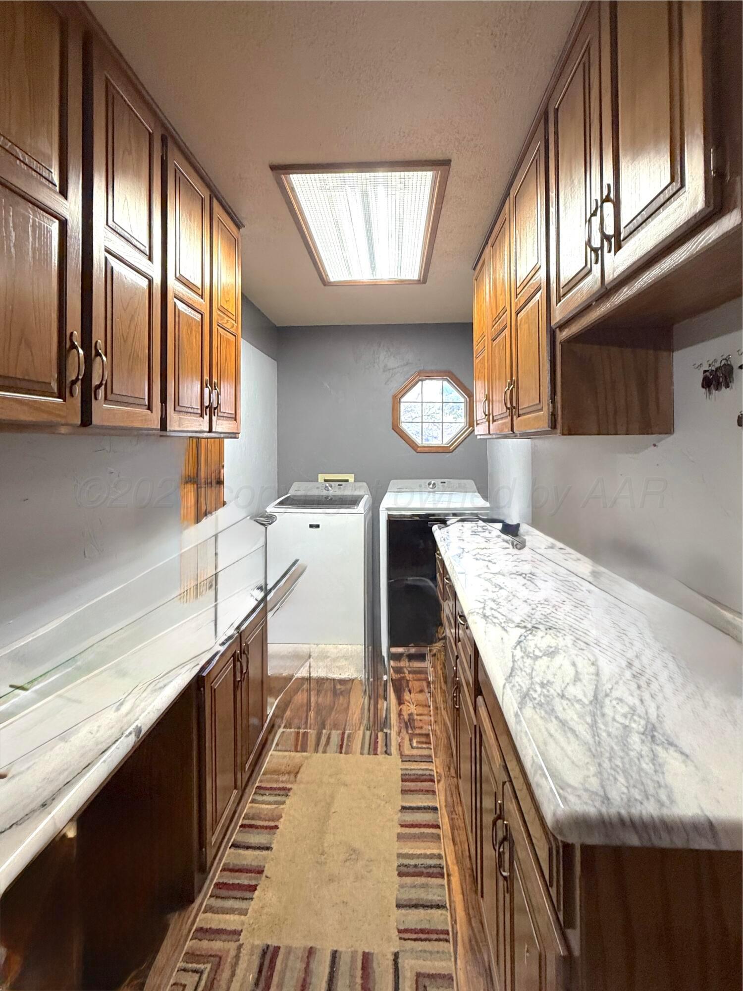2005 Lister Street Borger, TX 79007 - Photo 16 of 20 a kitchen with a stove and a sink