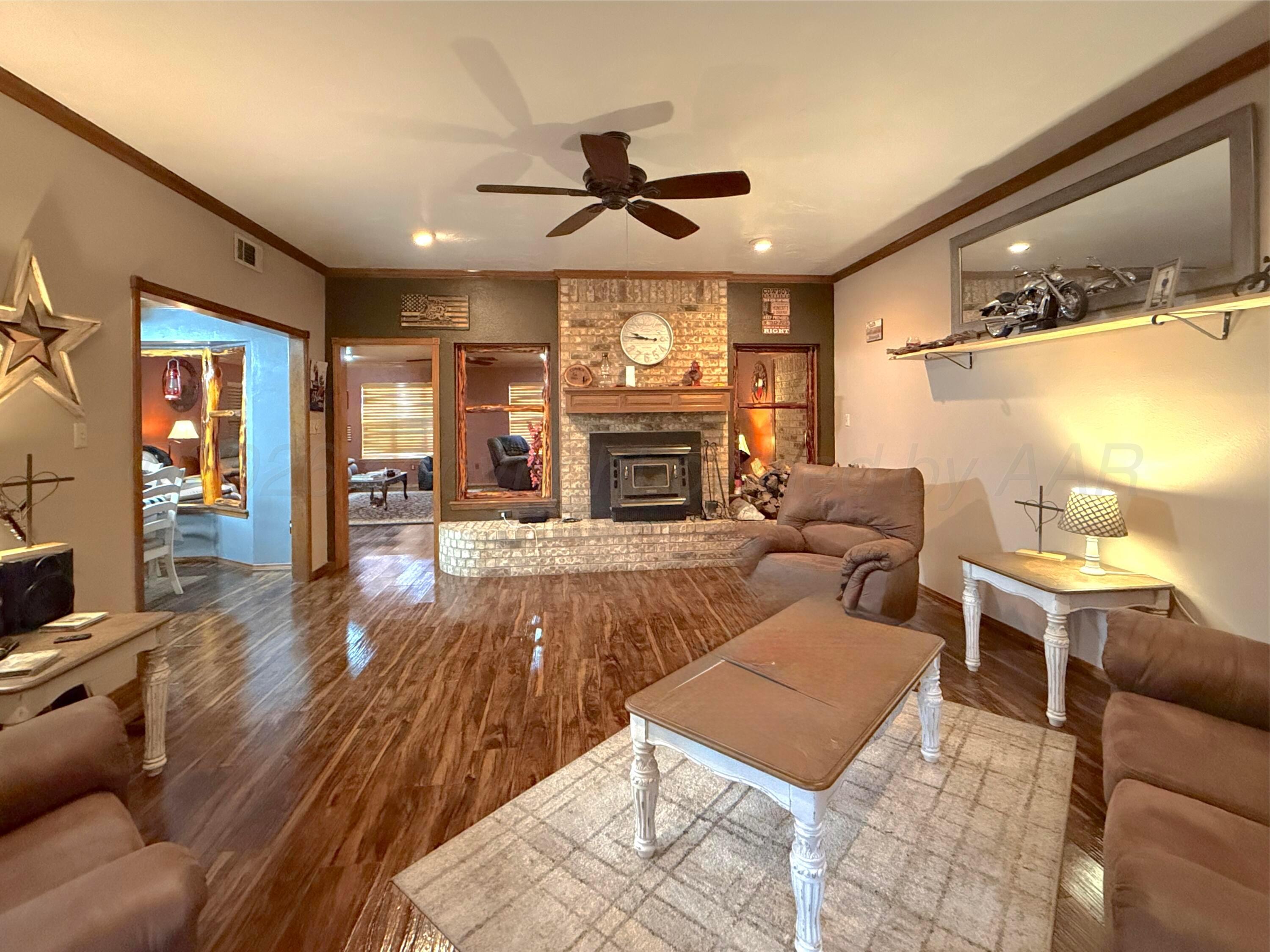 2005 Lister Street Borger, TX 79007 - Photo 5 of 20 a living room with furniture and a fireplace