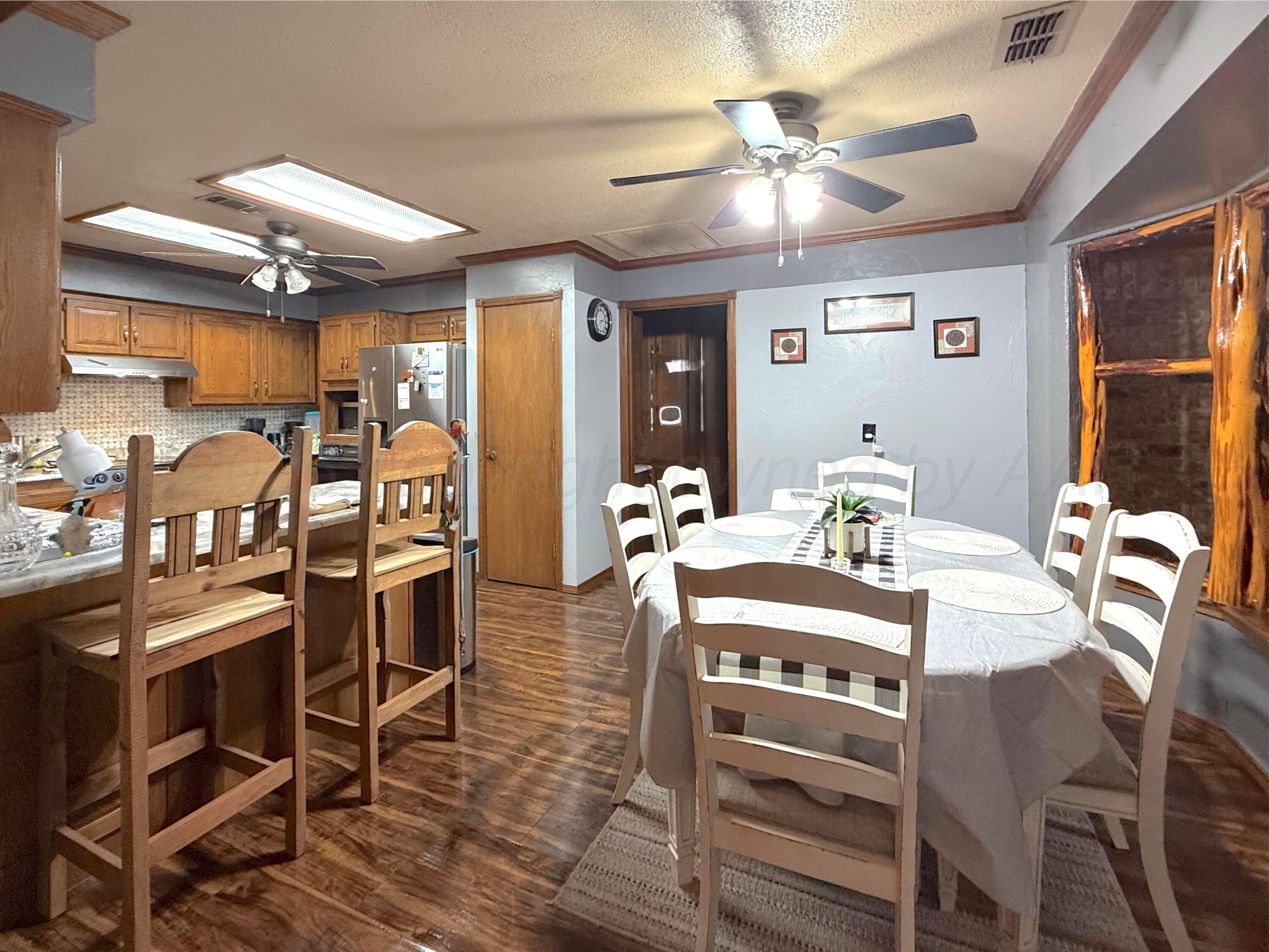 2005 Lister Street Borger, TX 79007 - Photo 7 of 20 a view of a dining room with furniture and chandelier