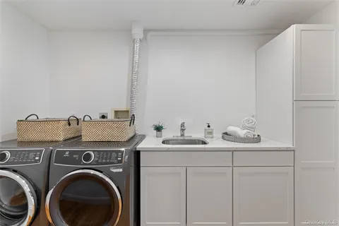 a utility room with dryer and washer