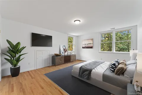 a bedroom with a bed and a couch