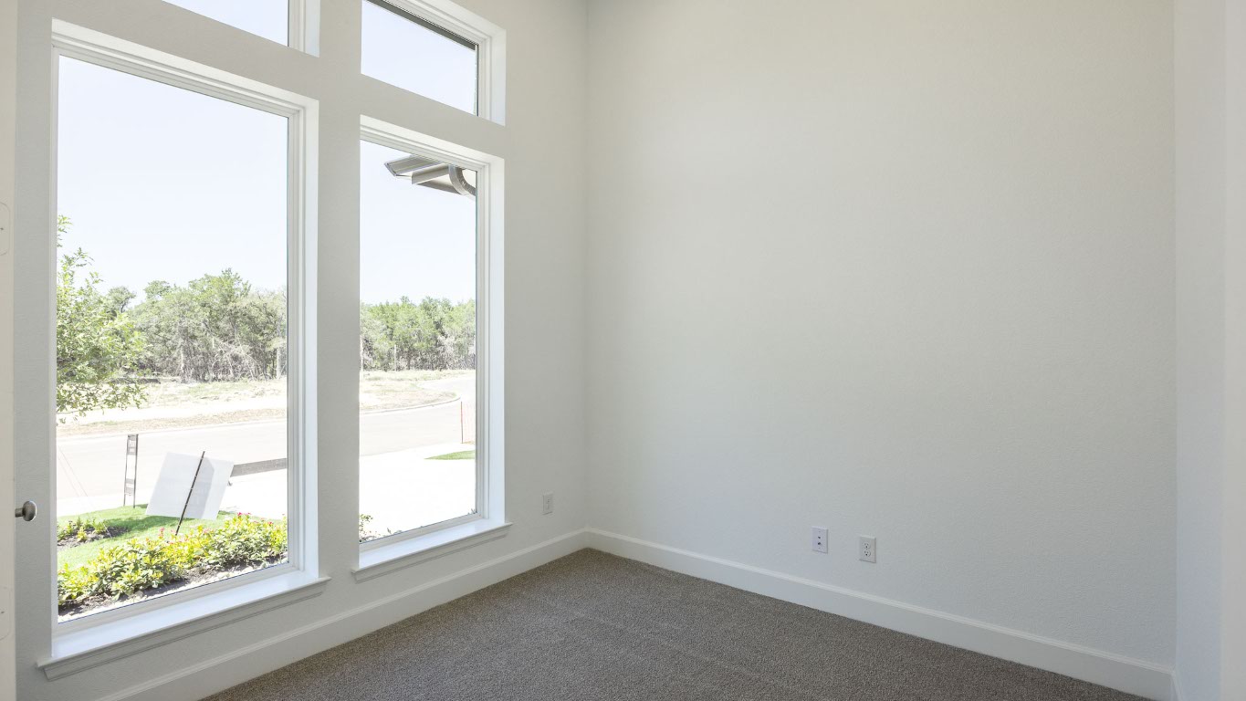 121 Adali Avenue Georgetown, TX 78633 - Photo 11 of 17 Unfurnished room featuring baseboards and dark colored carpet