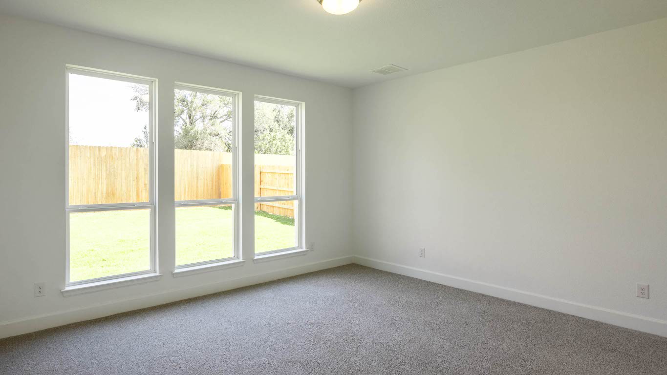 121 Adali Avenue Georgetown, TX 78633 - Photo 9 of 17 Empty room with baseboards and carpet floors