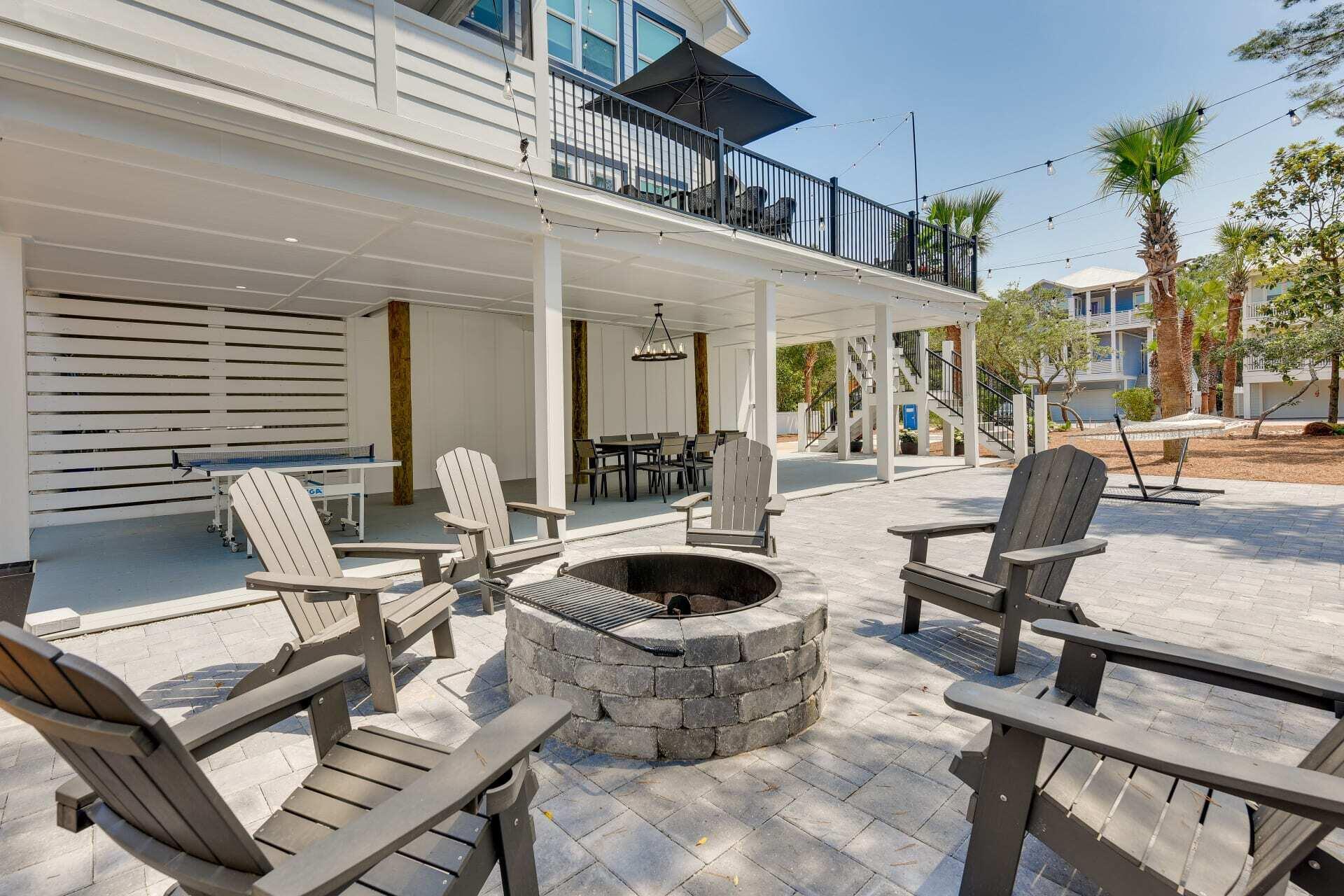57 North Spooky Lane Santa Rosa Beach, FL 32459 - Photo 8 of 13 a building outdoor space with patio furniture and potted plants