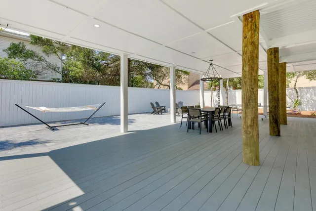 a view of a patio with table and chairs