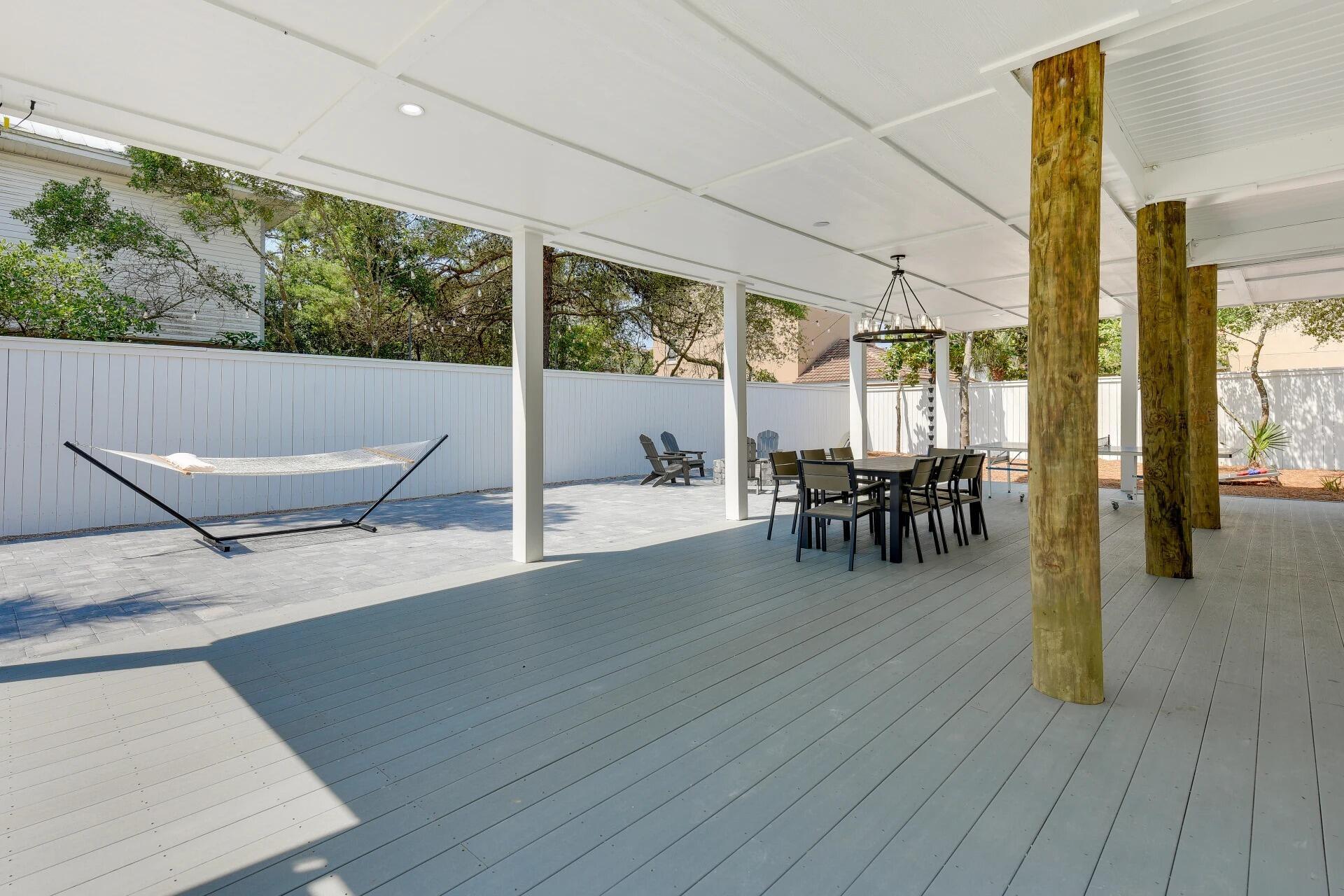 57 North Spooky Lane Santa Rosa Beach, FL 32459 - Photo 9 of 13 a view of a patio with table and chairs