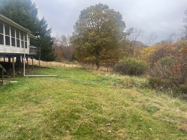 3035 Slack Road Mount Perry, OH 43760 - Photo 4 of 24 View of grassy yard with a deck and a sunroom
