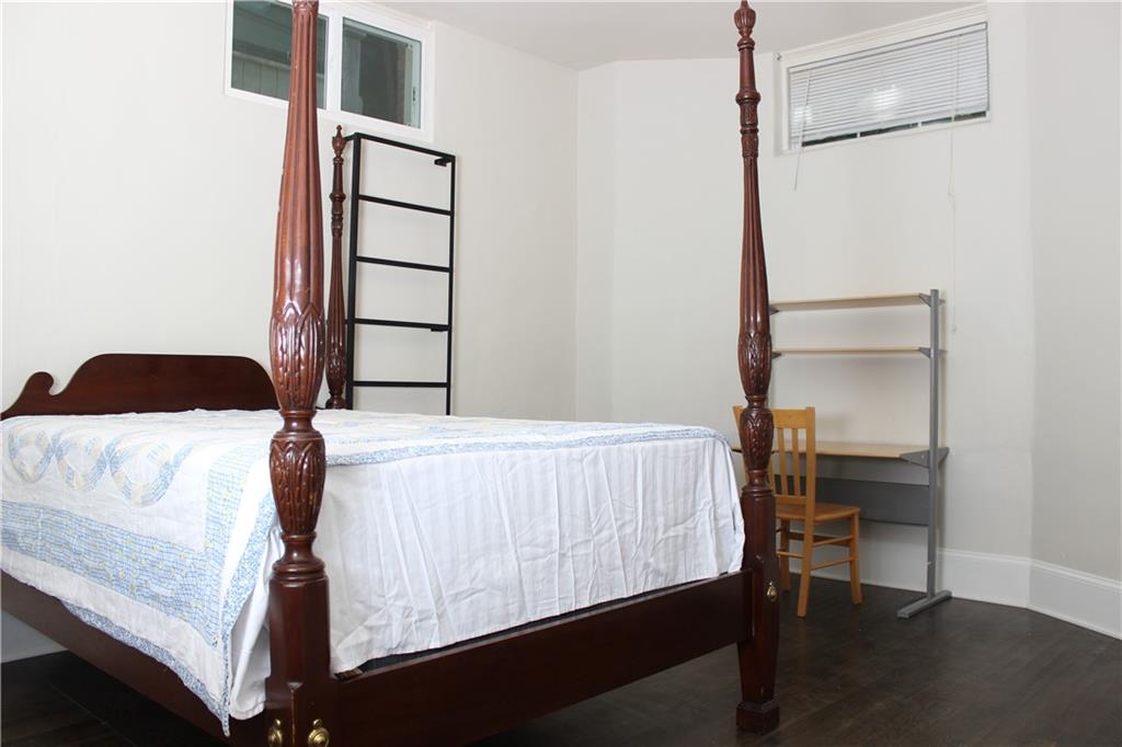 1124 Center Street Northwest Atlanta, GA 30318 - Photo 13 of 20 a bedroom with a bed and a window