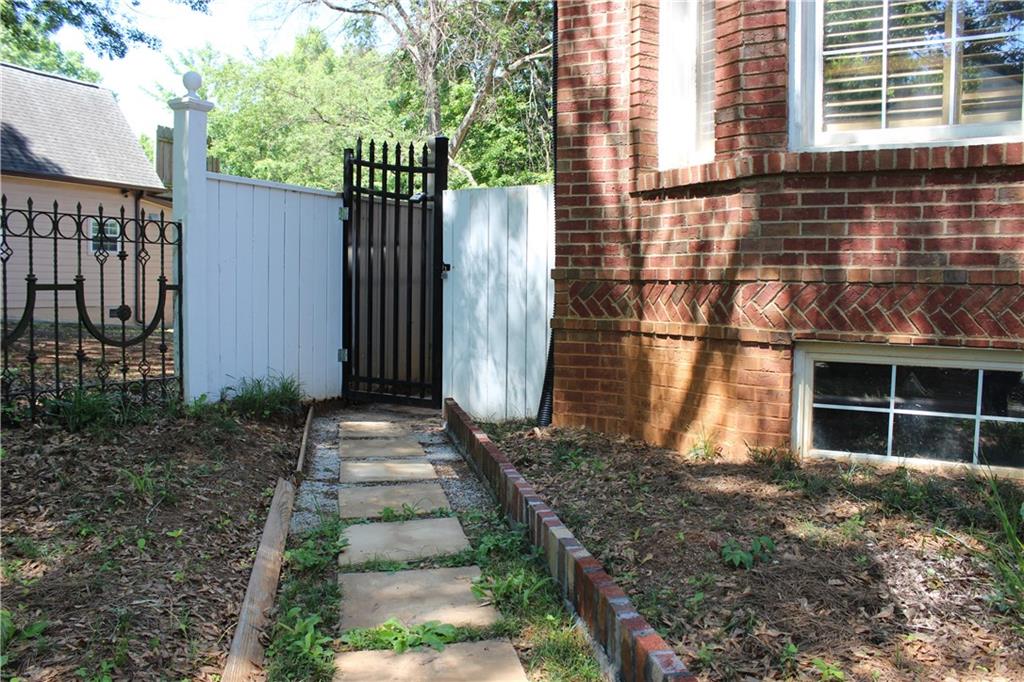 1124 Center Street Northwest Atlanta, GA 30318 - Photo 16 of 20 a front view of a house with a garden