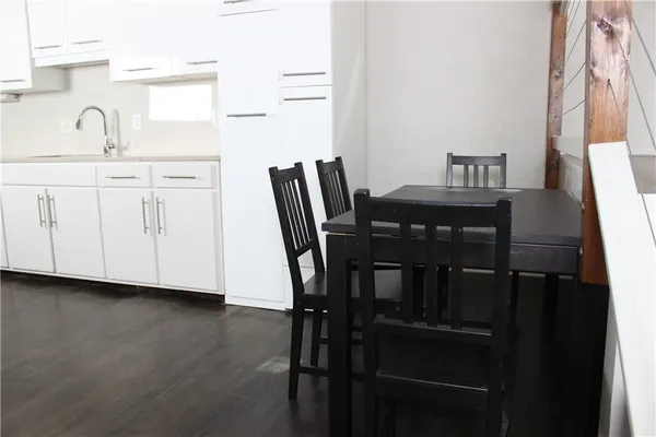 a view of a dining room with furniture and window