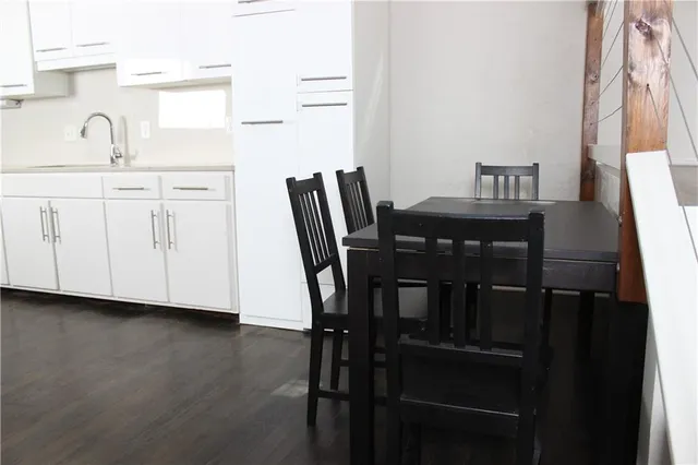 a view of a dining room with furniture and window