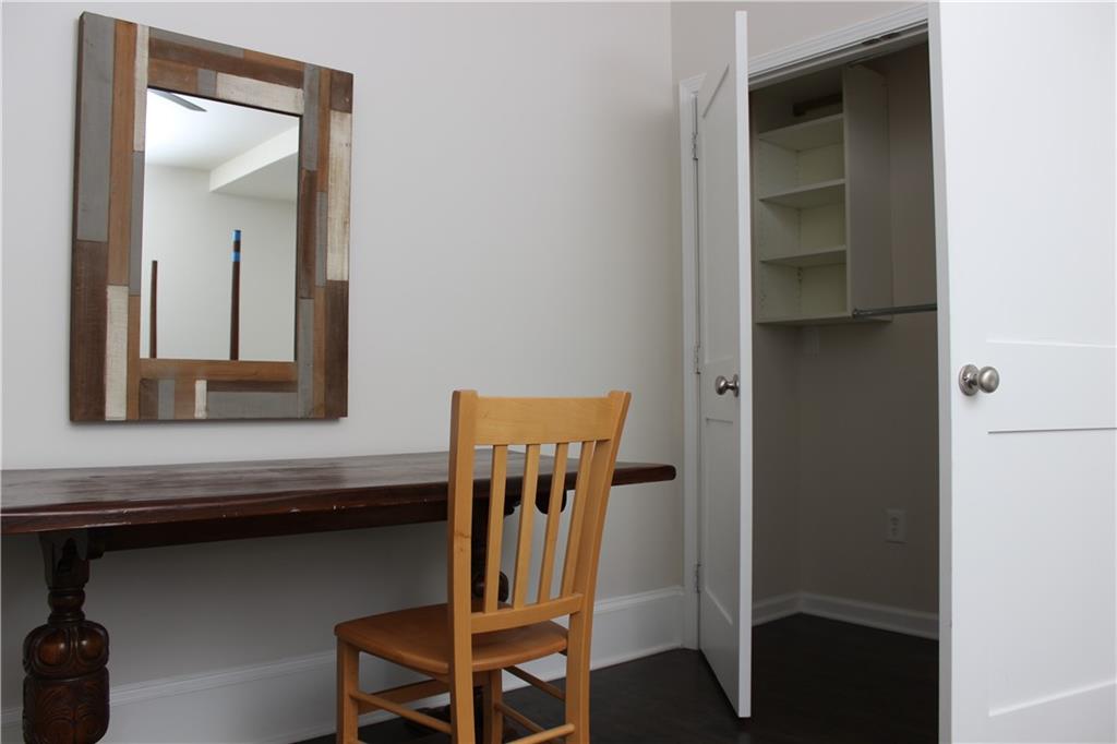 1124 Center Street Northwest Atlanta, GA 30318 - Photo 10 of 20 a view of hallway with chair and frames on wall