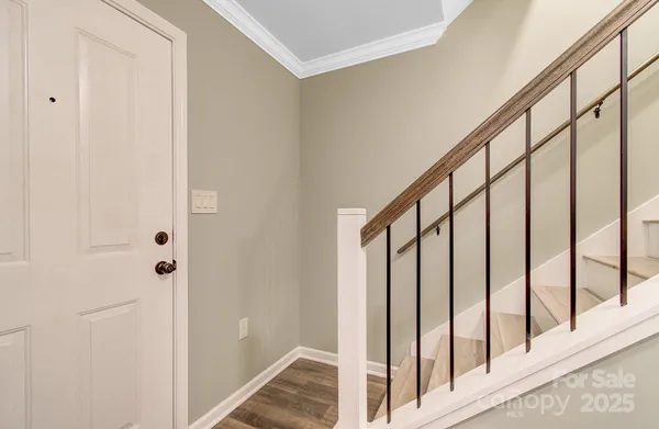 a view of staircase with rug