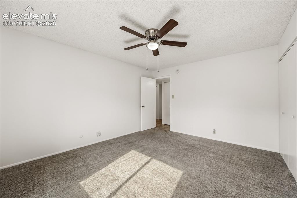 1018 Fontmore Road, Unit A Colorado Springs, CO 80904 - Photo 17 of 28 a view of room with a ceiling fan