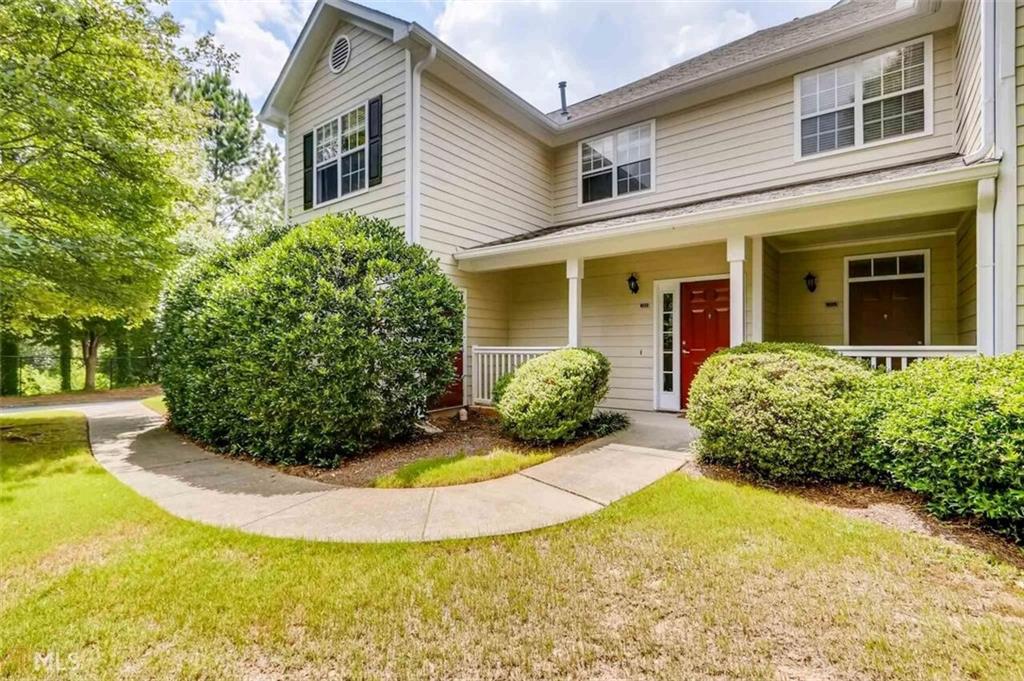 711 Spring Heights Lane, Unit 711 Smyrna, GA 30080 - Photo 1 of 30 a view of a house with pool and plants