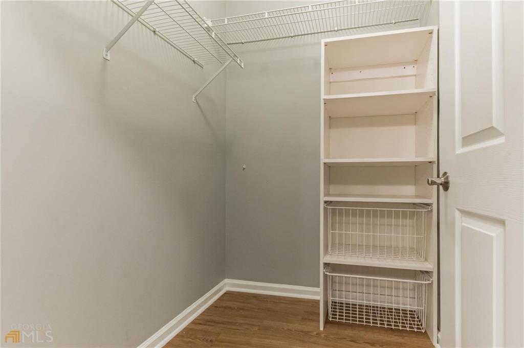711 Spring Heights Lane, Unit 711 Smyrna, GA 30080 - Photo 15 of 30 a view of walk in closet with empty racks
