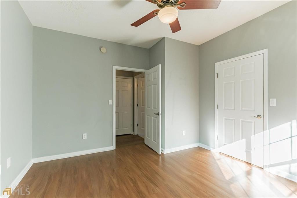 711 Spring Heights Lane, Unit 711 Smyrna, GA 30080 - Photo 16 of 30 a view of an empty room with wooden floor