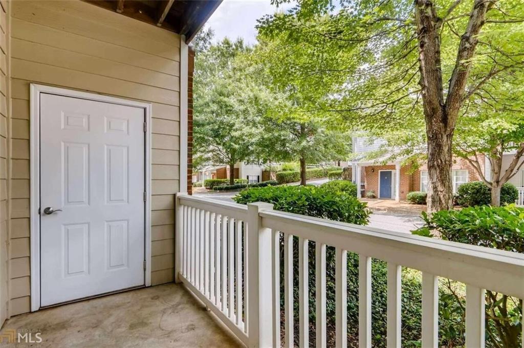 711 Spring Heights Lane, Unit 711 Smyrna, GA 30080 - Photo 23 of 30 a front view of a house with a porch