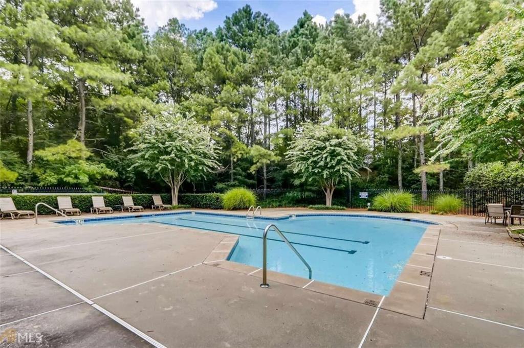 711 Spring Heights Lane, Unit 711 Smyrna, GA 30080 - Photo 25 of 30 a view of swimming pool with chairs