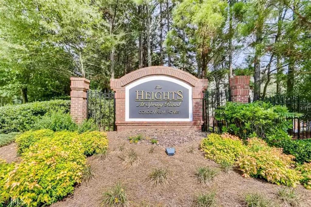 711 Spring Heights Lane, Unit 711 Smyrna, GA 30080 - Photo 26 of 30 a sign that is next to a road