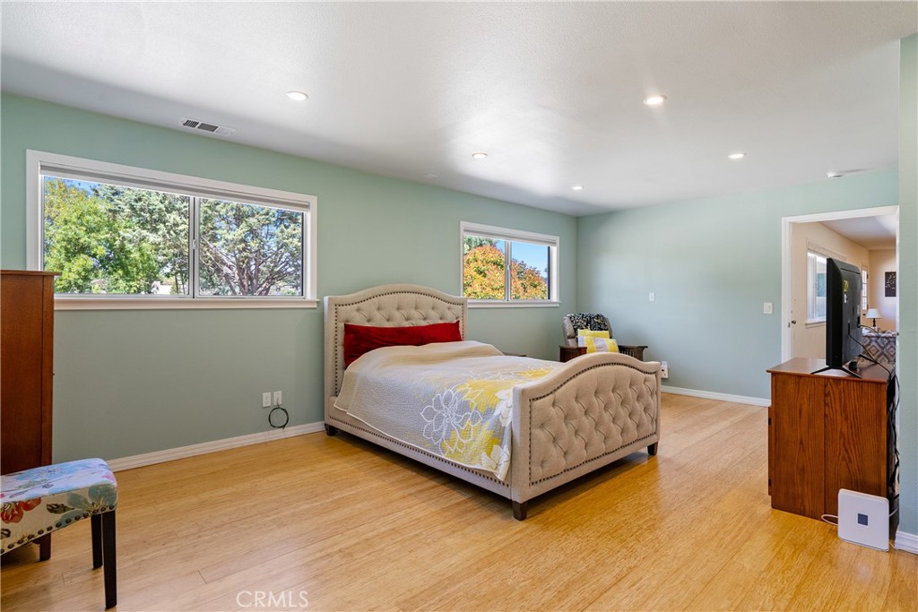 3388 Ramona Road Atascadero, CA 93422 - Photo 29 of 55 Multiple windows flood the room with natural light. The primary bedroom also offers bamboo floors and recessed lights.