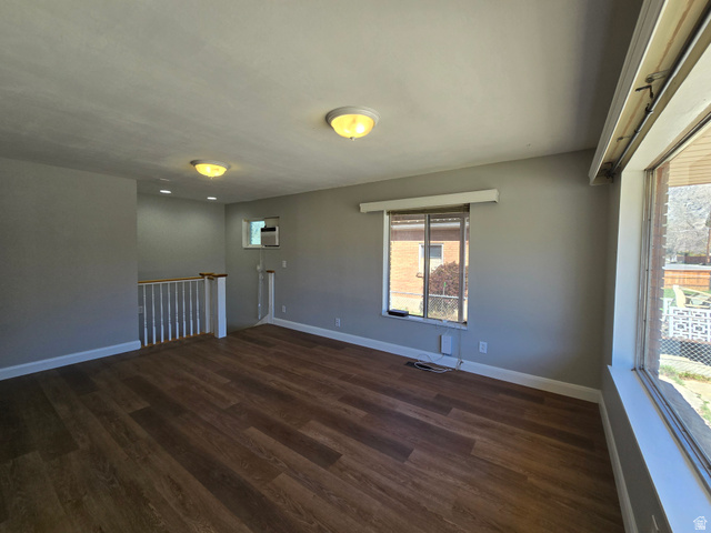 490 Averett Avenue, Unit 1 Springville, UT 84663 - Photo 4 of 11 Spare room featuring dark wood-style floors and baseboards