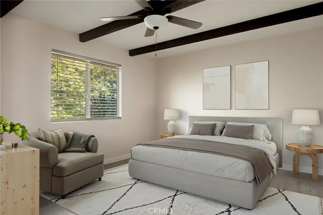 a bedroom with a bed couch and window