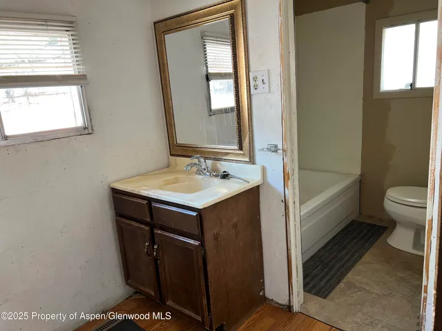 a bathroom with a sink and a toilet