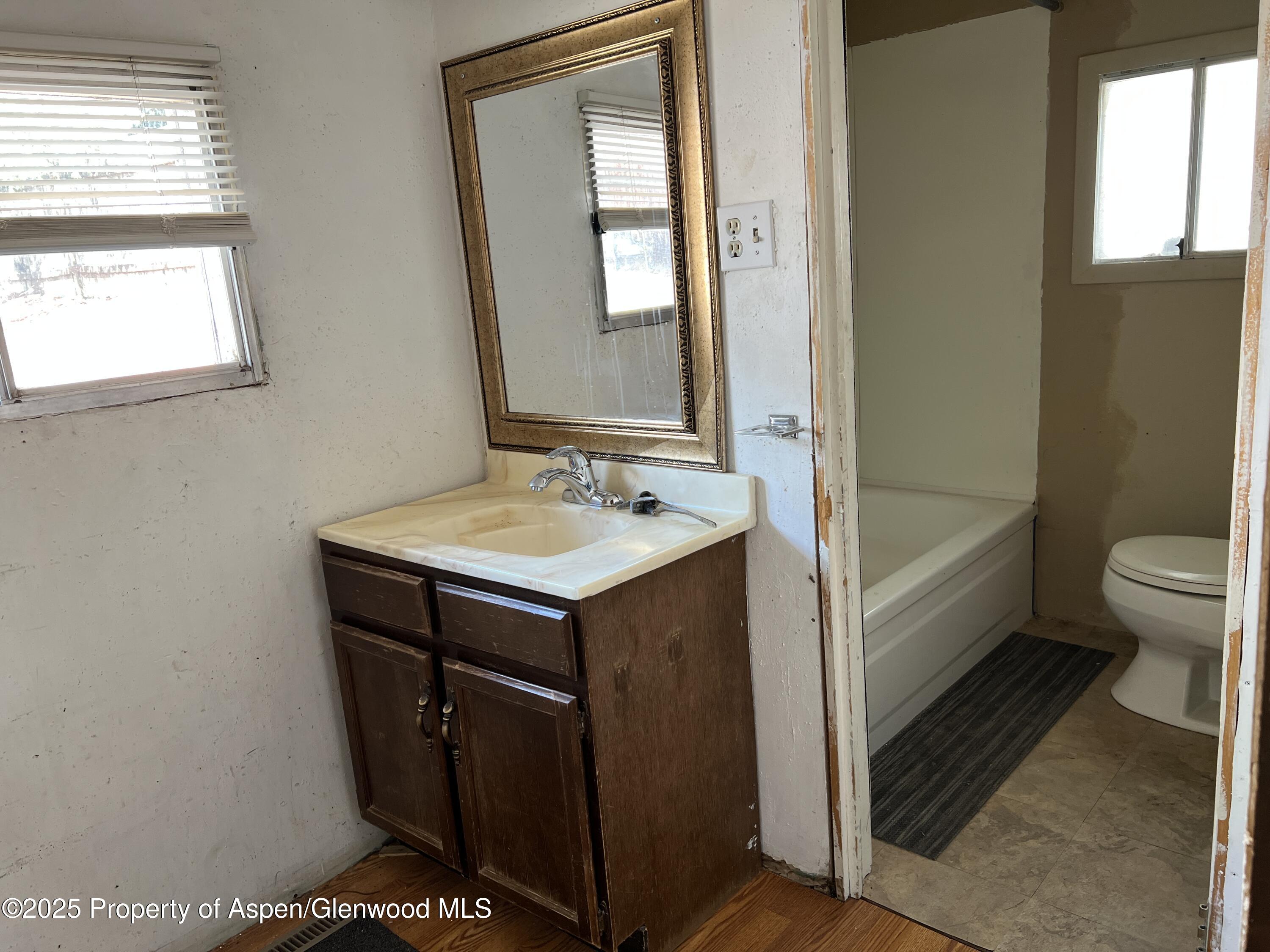 420 West 16th Street Rifle, CO 81650 - Photo 23 of 37 a bathroom with a sink a toilet and shower